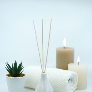 white pillar candles on white ceramic holder